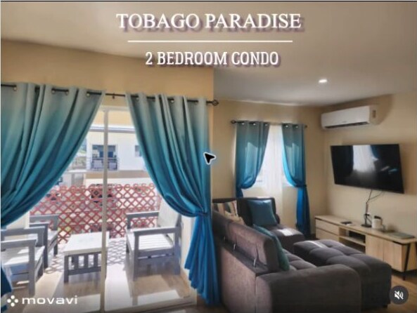 Living room and balcony at Tobago Paradise Condo